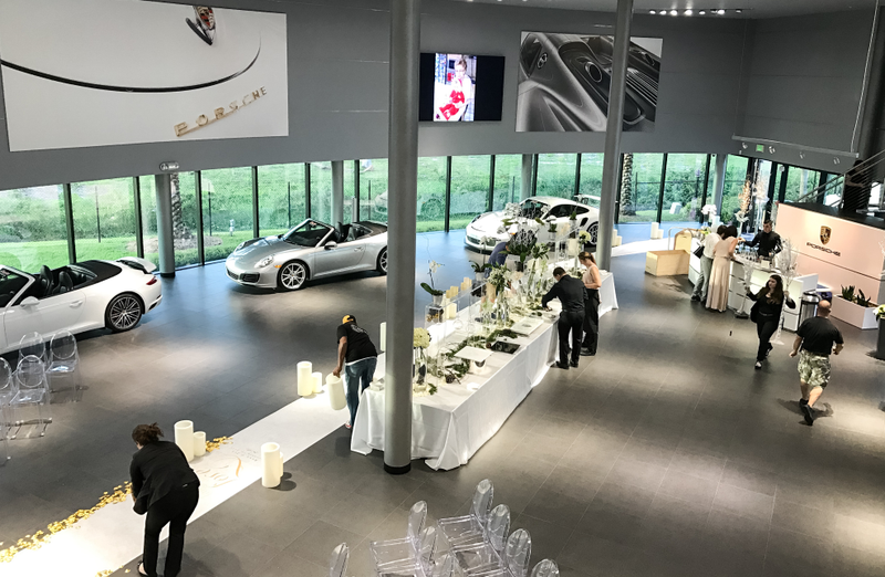 Illustration for article titled This Couple Topped Your Wildest Dreams By Getting Married In A Porsche Showroom